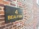 Sign for 4 Beaufain displayed on the brick building exterior at 4 Beaufain St # 207, Charleston, SC 29401