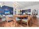 Dining space with a round wooden table and chairs, flowing into the living room and kitchen at 4 Beaufain St # 207, Charleston, SC 29401