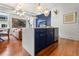 Stylish open kitchen with marble countertop island and stainless steel appliances at 4 Beaufain St # 207, Charleston, SC 29401