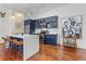 Modern kitchen with stainless steel appliances and marble countertop island at 4 Beaufain St # 207, Charleston, SC 29401