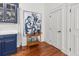 Kitchenette featuring blue cabinets, a bar cart with liquor, and white doors leading to other rooms at 4 Beaufain St # 207, Charleston, SC 29401