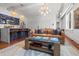 Living room with a kitchen island, a seating area, and dining, creating a modern living space at 4 Beaufain St # 207, Charleston, SC 29401