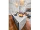 Kitchen island transitioning to a dining and living space, enhancing the functionality and aesthetic of this open floorplan design at 4 Beaufain St # 207, Charleston, SC 29401