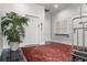 Elegant lobby with vibrant rug, potted palm, and mailboxes with elevator access at 4 Beaufain St # 207, Charleston, SC 29401