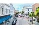 Wide street view with historic architecture, street parking, and stores with blue awnings at 4 Beaufain St # 207, Charleston, SC 29401