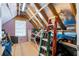 Unfinished attic space with exposed rafters and insulation, offering potential for storage or customization at 411 Topcrest Ln, Moncks Corner, SC 29461