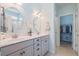 Bright bathroom featuring double vanity, modern lighting and a walk-in closet that is perfect for any home at 411 Topcrest Ln, Moncks Corner, SC 29461