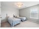 Charming bedroom featuring twin beds with patterned linens and decorative wallpaper that enhances the room's character at 411 Topcrest Ln, Moncks Corner, SC 29461