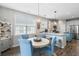 Open-concept dining area with a modern chandelier adjacent to the kitchen at 411 Topcrest Ln, Moncks Corner, SC 29461
