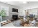 Inviting living room with a fireplace, comfortable seating, and natural light at 411 Topcrest Ln, Moncks Corner, SC 29461