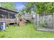 A spacious backyard with a screened porch, raised deck, playhouse, and a garden area at 414 Birch Ave, Goose Creek, SC 29445