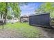 Lush backyard with a cozy gazebo, outdoor cooking setup, and spacious storage shed at 414 Birch Ave, Goose Creek, SC 29445