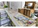 Custom outdoor bar featuring a long, unique countertop with decorative logos and a sink for convenience at 414 Birch Ave, Goose Creek, SC 29445