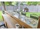 Unique backyard bar with logo-covered counter, perfect for entertaining guests in a fun, casual setting at 414 Birch Ave, Goose Creek, SC 29445