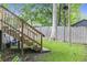 Backyard stairs from upper deck leading to a lush lawn, providing outdoor access at 414 Birch Ave, Goose Creek, SC 29445