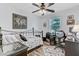 This bedroom features a ceiling fan, a desk, and a decorative map on the wall at 414 Birch Ave, Goose Creek, SC 29445
