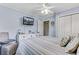 A bedroom featuring a TV, ceiling fan, closet, and coastal decor at 414 Birch Ave, Goose Creek, SC 29445