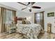 Cozy bedroom with wood-look floors, a ceiling fan, and nature-themed accents at 414 Birch Ave, Goose Creek, SC 29445