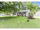 Well maintained home with a large, green lawn and beautiful landscaping creates excellent curb appeal at 414 Birch Ave, Goose Creek, SC 29445