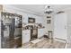 Kitchen with black appliances, white cabinets, and wine-themed decor, combining functionality and style at 414 Birch Ave, Goose Creek, SC 29445