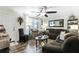 Comfortable living room featuring lots of natural light, wood-look floors, ceiling fan, and a cozy atmosphere at 414 Birch Ave, Goose Creek, SC 29445