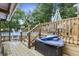 View of above ground pool and deck featuring outdoor seating, lounge float, and wooded backyard at 414 Birch Ave, Goose Creek, SC 29445