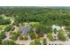 Community aerial view featuring a clubhouse and pool, highlighting amenities in a lush, green environment at 4272 Persimmon Woods Dr, Charleston, SC 29420