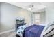 Bright bedroom featuring a ceiling fan, television, and doorway to the upstairs hall at 4272 Persimmon Woods Dr, Charleston, SC 29420