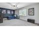 Modern bedroom with a ceiling fan, natural lighting, and unique decorations at 4272 Persimmon Woods Dr, Charleston, SC 29420
