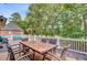 Spacious deck with comfortable furniture and serene views of the lush, tree-filled landscape at 4272 Persimmon Woods Dr, Charleston, SC 29420