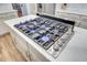 Modern gas range cooktop with stainless steel accents is featured in this bright kitchen at 4272 Persimmon Woods Dr, Charleston, SC 29420