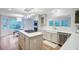 Spacious kitchen boasts a center island with gas cooktop, stainless appliances, and natural light at 4272 Persimmon Woods Dr, Charleston, SC 29420