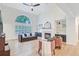 Cozy living room features a fireplace, vaulted ceilings and a large window, perfect for relaxing at 4272 Persimmon Woods Dr, Charleston, SC 29420