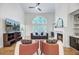 Bright living room with fireplace, vaulted ceilings, large window, and stylish decor perfect for entertaining at 4272 Persimmon Woods Dr, Charleston, SC 29420