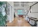 Spacious living room with hardwood floors, soaring ceilings, stylish decor, and a cozy fireplace at 4272 Persimmon Woods Dr, Charleston, SC 29420
