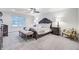 Spacious main bedroom with a ceiling fan, neutral carpet, and large window for natural light at 4272 Persimmon Woods Dr, Charleston, SC 29420