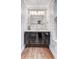 Stylish powder room with a modern vanity, unique wallpaper, and updated lighting at 4272 Persimmon Woods Dr, Charleston, SC 29420