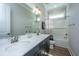 Bathroom with double sink, white countertops, dark wood cabinets, white subway tile, and a combined shower and tub at 436 Ripple Park Dr, Summerville, SC 29486