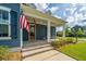 Inviting front porch with a brick pathway, American flag, and a cozy seating area at 436 Ripple Park Dr, Summerville, SC 29486