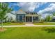Charming two-story home with well-manicured lawn and a welcoming front porch at 436 Ripple Park Dr, Summerville, SC 29486