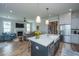 Modern kitchen with stainless steel appliances, a center island with seating, and an open view to the living room at 436 Ripple Park Dr, Summerville, SC 29486