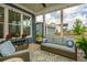 The screened in patio offers an outdoor sofa, seating, outdoor decor, screened windows and a ceiling fan at 436 Ripple Park Dr, Summerville, SC 29486