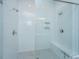 Modern walk-in shower featuring white subway tiles, a built-in bench, and multiple showerheads for a luxurious feel at 436 Ripple Park Dr, Summerville, SC 29486