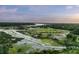 Picturesque aerial view of coastal marshland featuring a home in a lush green area at 4808 Wilson Rd, Meggett, SC 29449