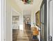 Inviting foyer with hardwood floors, natural light, stylish decor, and an open view to the dining and living areas at 4808 Wilson Rd, Meggett, SC 29449
