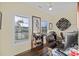 Home office with wood floors, large windows, and built-in shelving at 4808 Wilson Rd, Meggett, SC 29449
