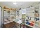 Well-organized pantry with ample shelving, a central island, and natural light at 4808 Wilson Rd, Meggett, SC 29449