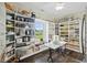 Organized pantry with custom shelving and a view to the outside, offering ample storage space at 4808 Wilson Rd, Meggett, SC 29449