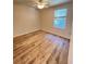 Bedroom featuring wood flooring, window and ceiling fan at 4816 Cane Pole Ln, Summerville, SC 29485