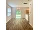 Dining area with laminate flooring and natural light from large windows to the backyard at 4816 Cane Pole Ln, Summerville, SC 29485